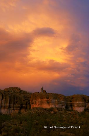 A storm clears over the volcanic rock formations of Las Cuevas Amarillas at Big Bend Ranch State Park.