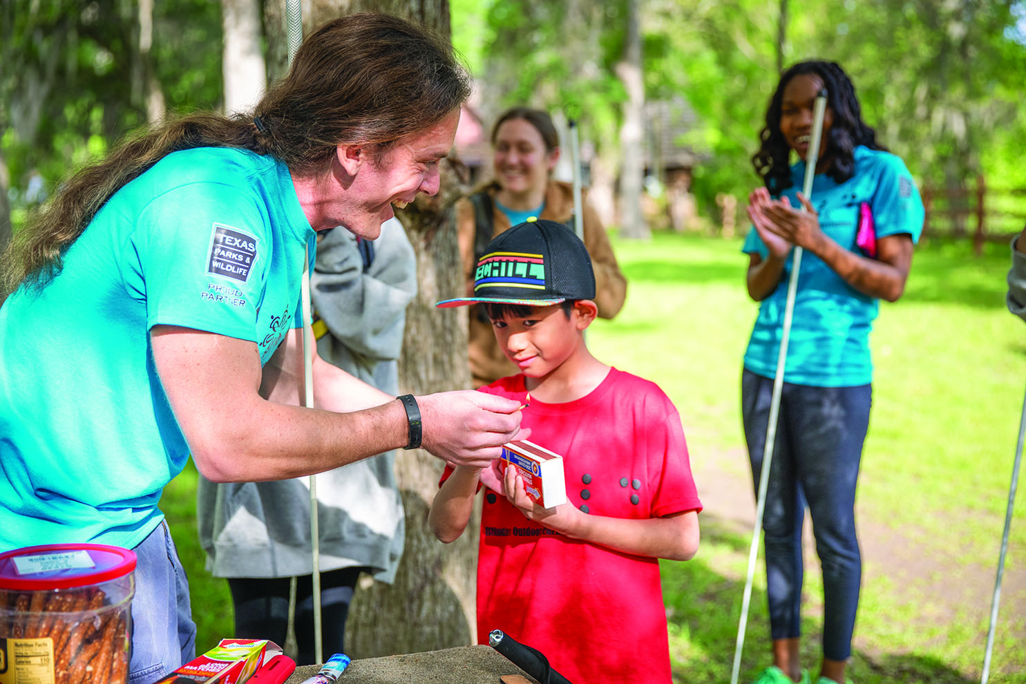Blind campers feel a matchbox striking strip