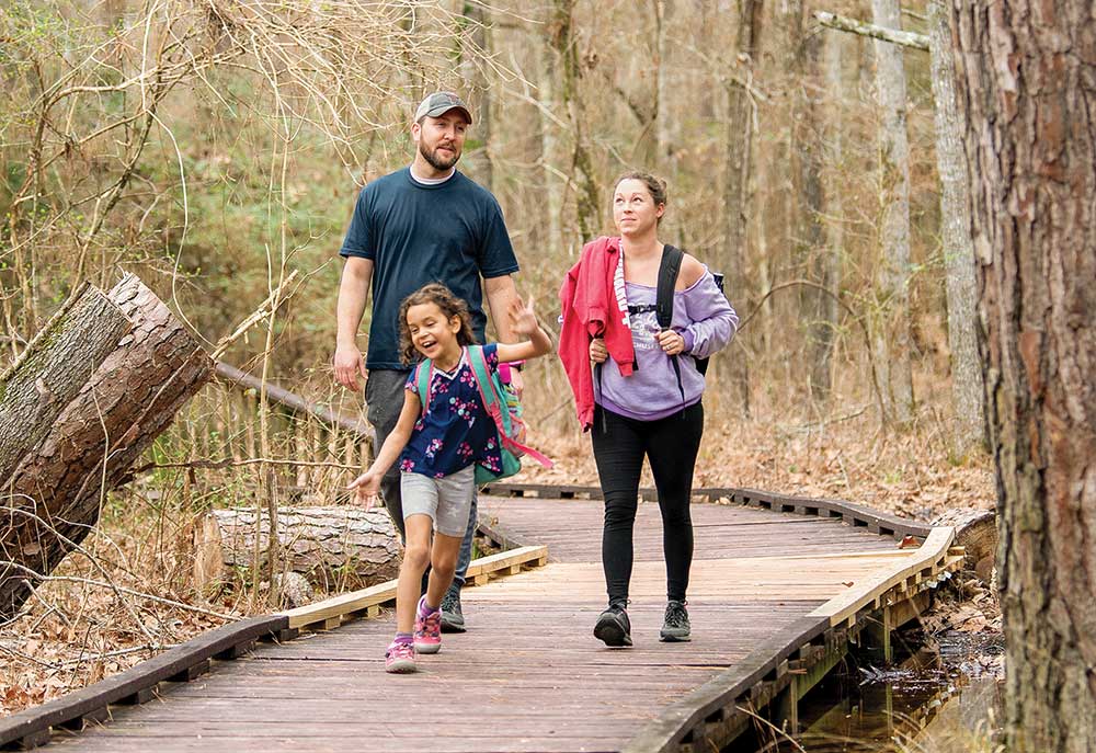 Family walking Pineywoods Boardwalk Trail