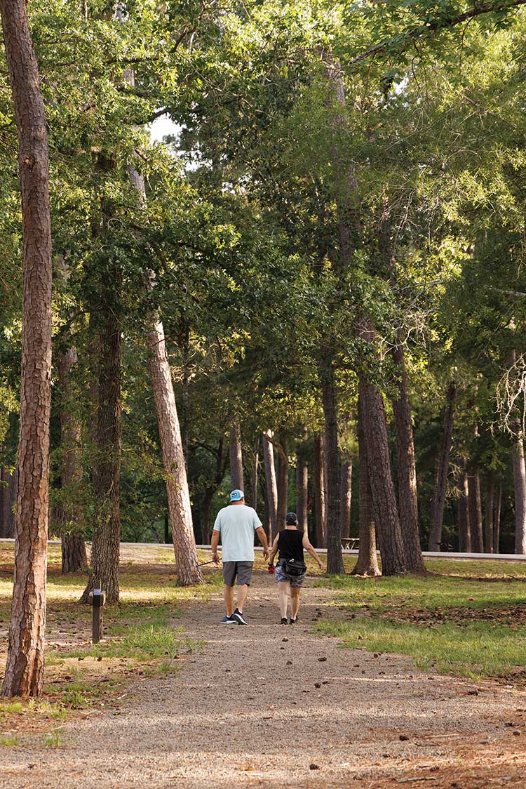 Couple walking Trinity Trace Trail