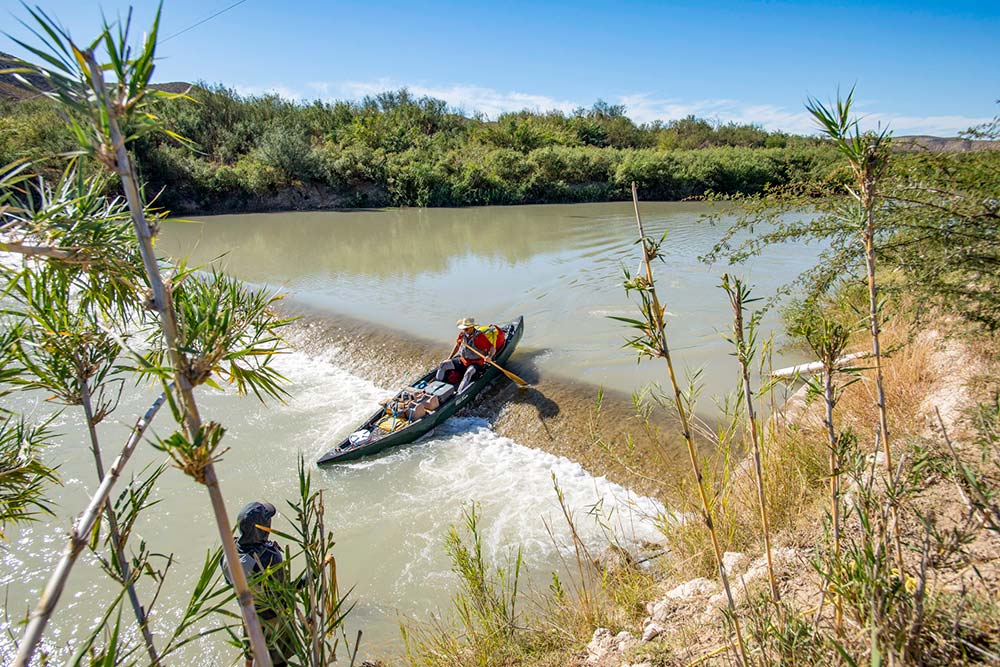 loaded canoe crossing
