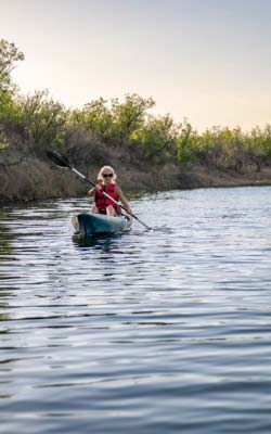 Paddler on Pecos River By Iraan
