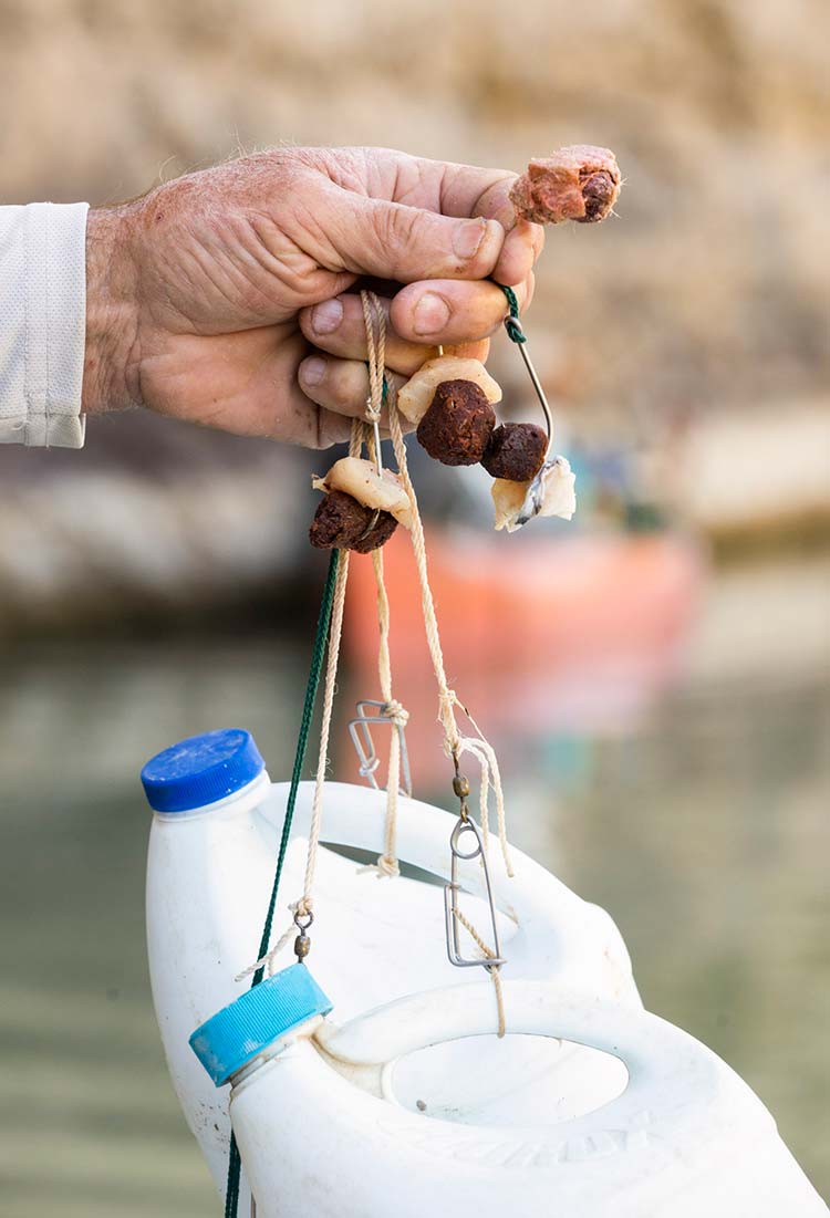 An angler prepares catfish bait