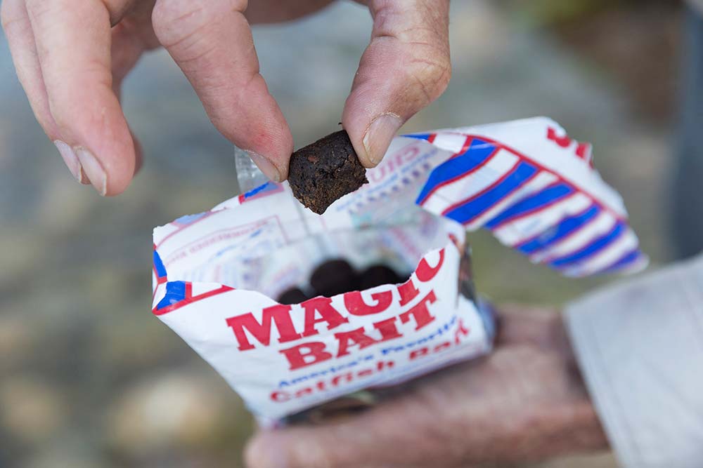 An angler prepares catfish bait