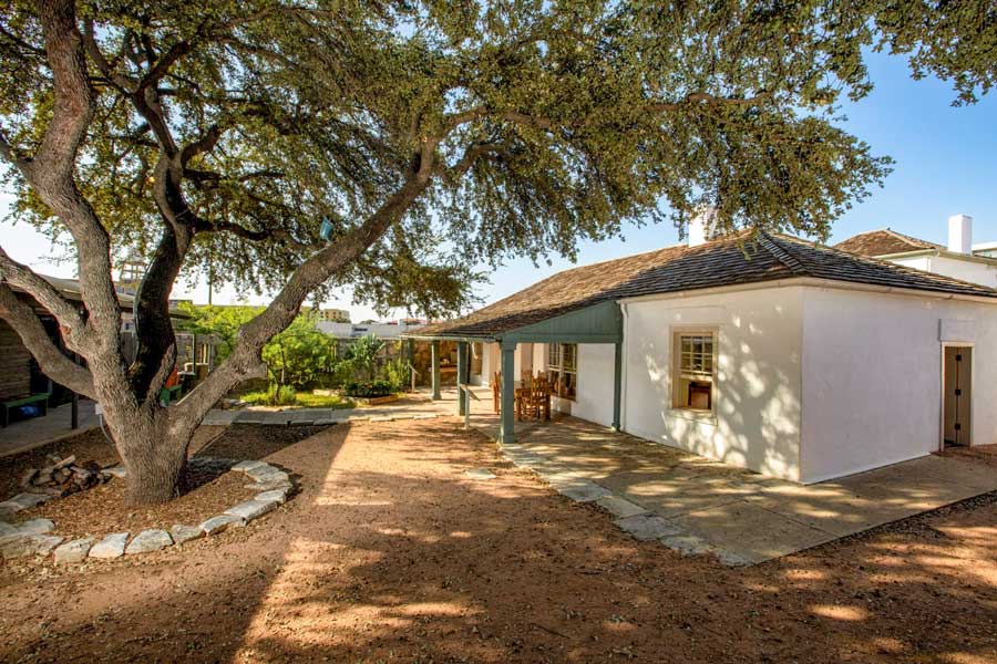 Exterior view of a white stucco building at Casa Navarro state historic site