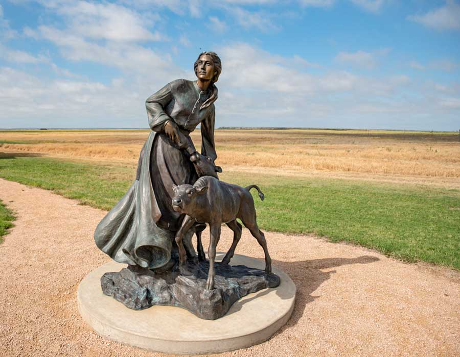 Statue of Mary Ann Goodnight and a calf
