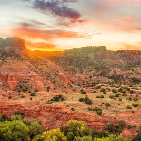 A sunrise over Sorenson Peak at Palo Duro Canyon State Park