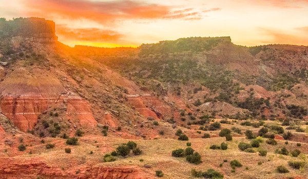 A sunrise over Sorenson Peak at Palo Duro Canyon State Park