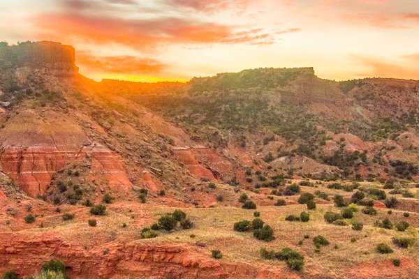 A sunrise over Sorenson Peak at Palo Duro Canyon State Park