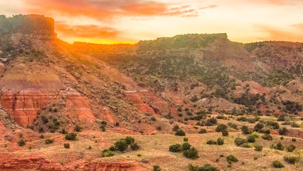 A sunrise over Sorenson Peak at Palo Duro Canyon State Park