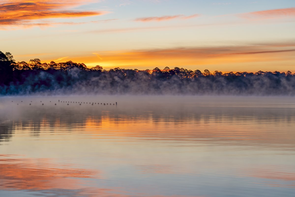 Foggy Steinhagen Reservoir at sunset.