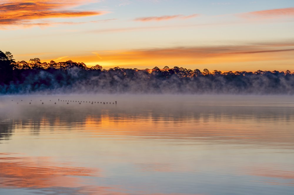 Foggy Steinhagen Reservoir at sunset.