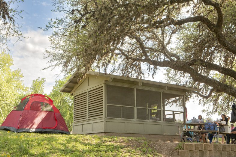 A tent and a screen structure at Blanco State Park