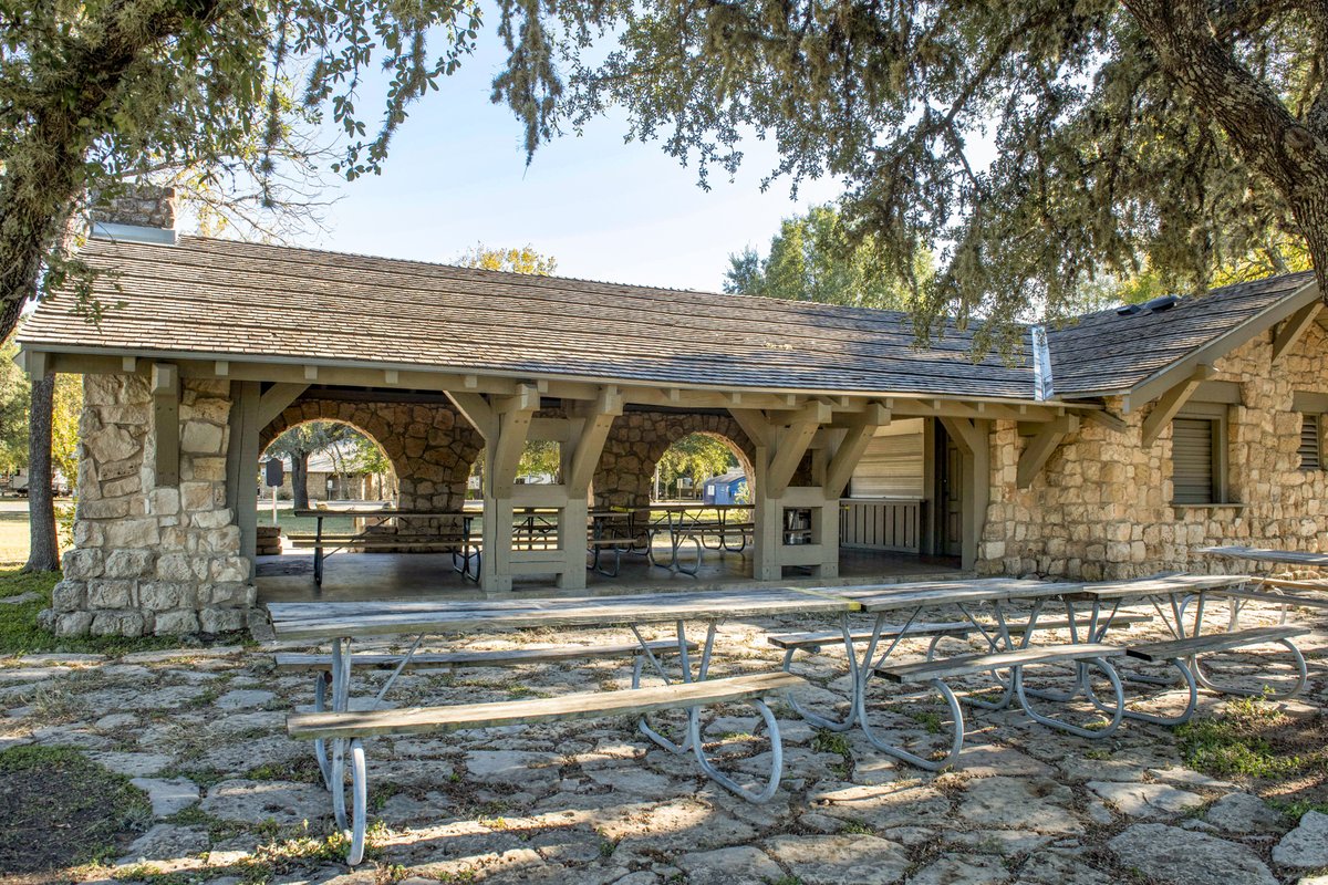 CCC Pavilion with picnic tables at Blanco State Park.