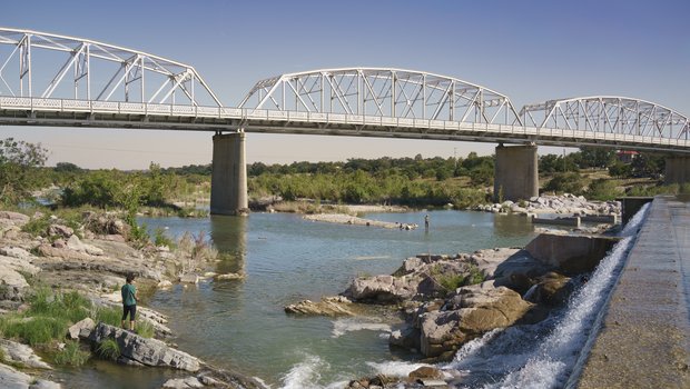 A bridge going over the Llano river.