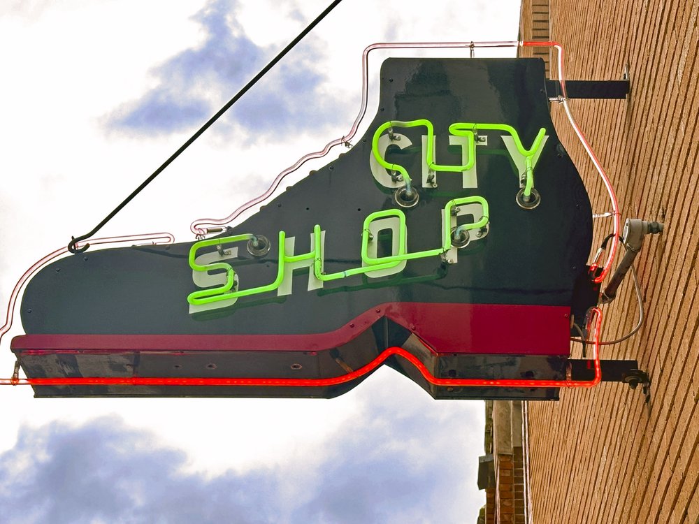 0325_Travel_Dogwood_2024 March Palestine Shoe Shop logo_JohnHOstdick