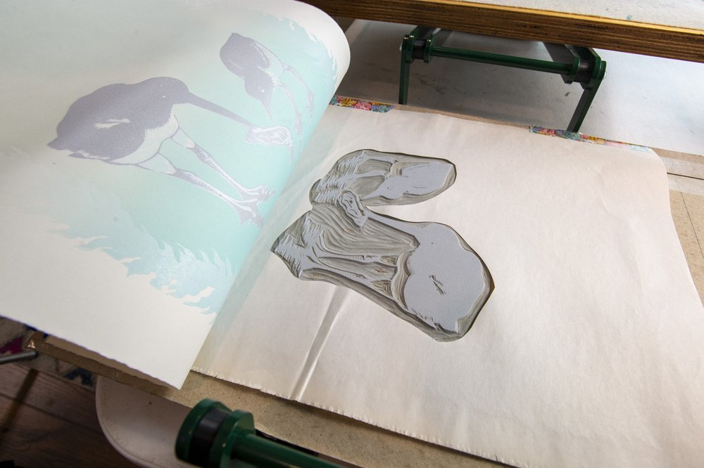 Paper being removed from a printing block.