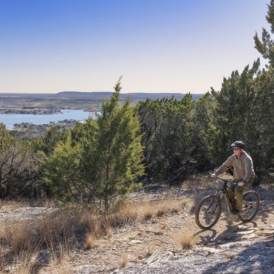 Person biking on the Possum Kingdom Hike and Bike Trail.