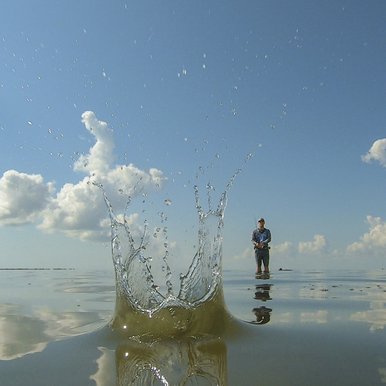Close-up of a splash in the water from an angler's cast