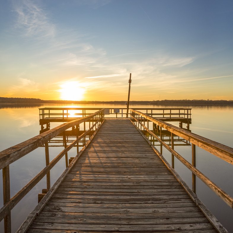 A fishing dock at sunrise or sunset