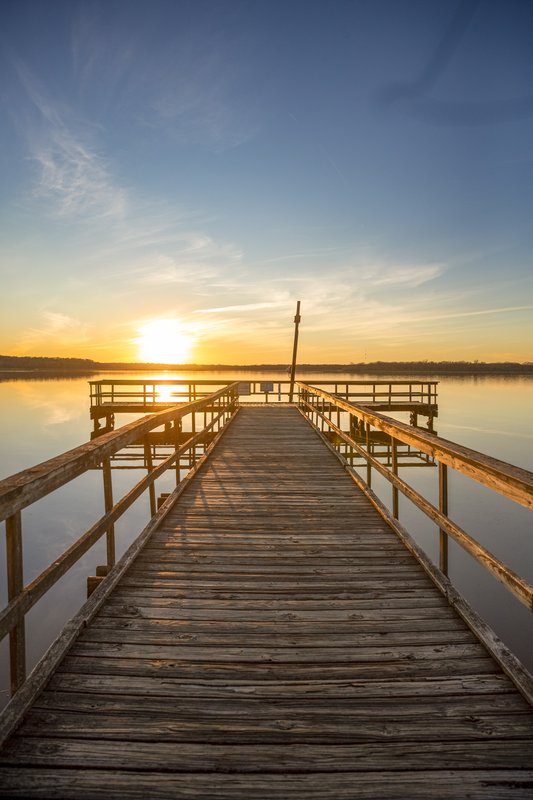 A fishing dock at sunrise or sunset