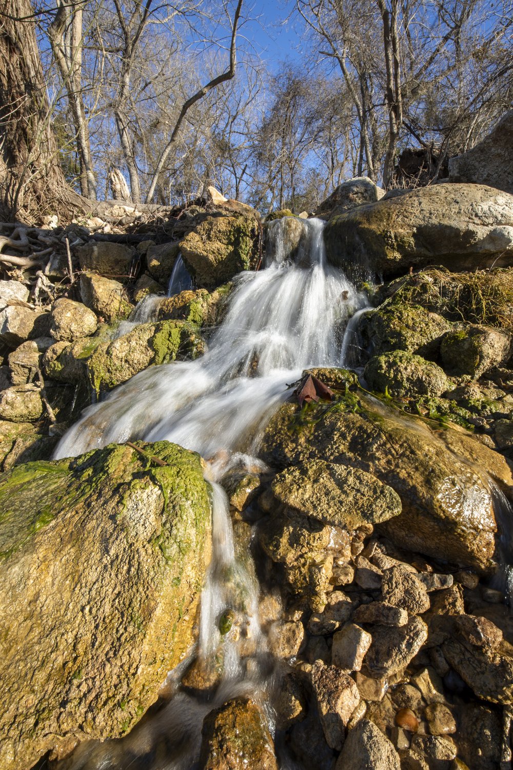 A small stream flows over rocks