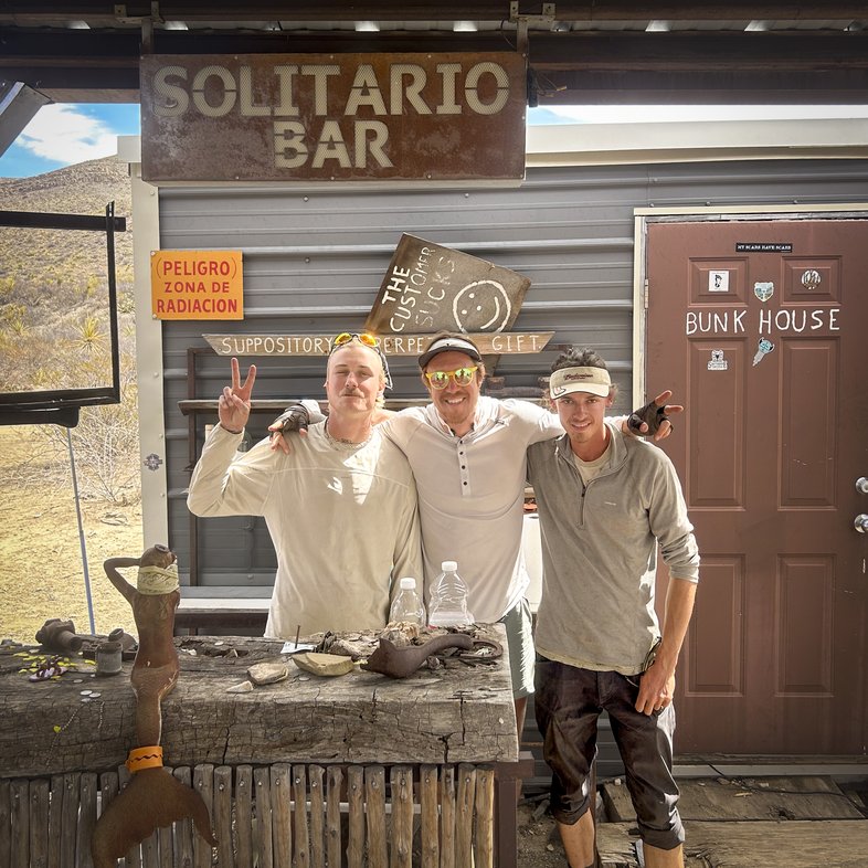 Three man standing in the Solitario Bar