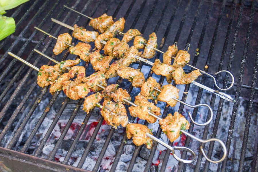 Alligator skewers on a grill.