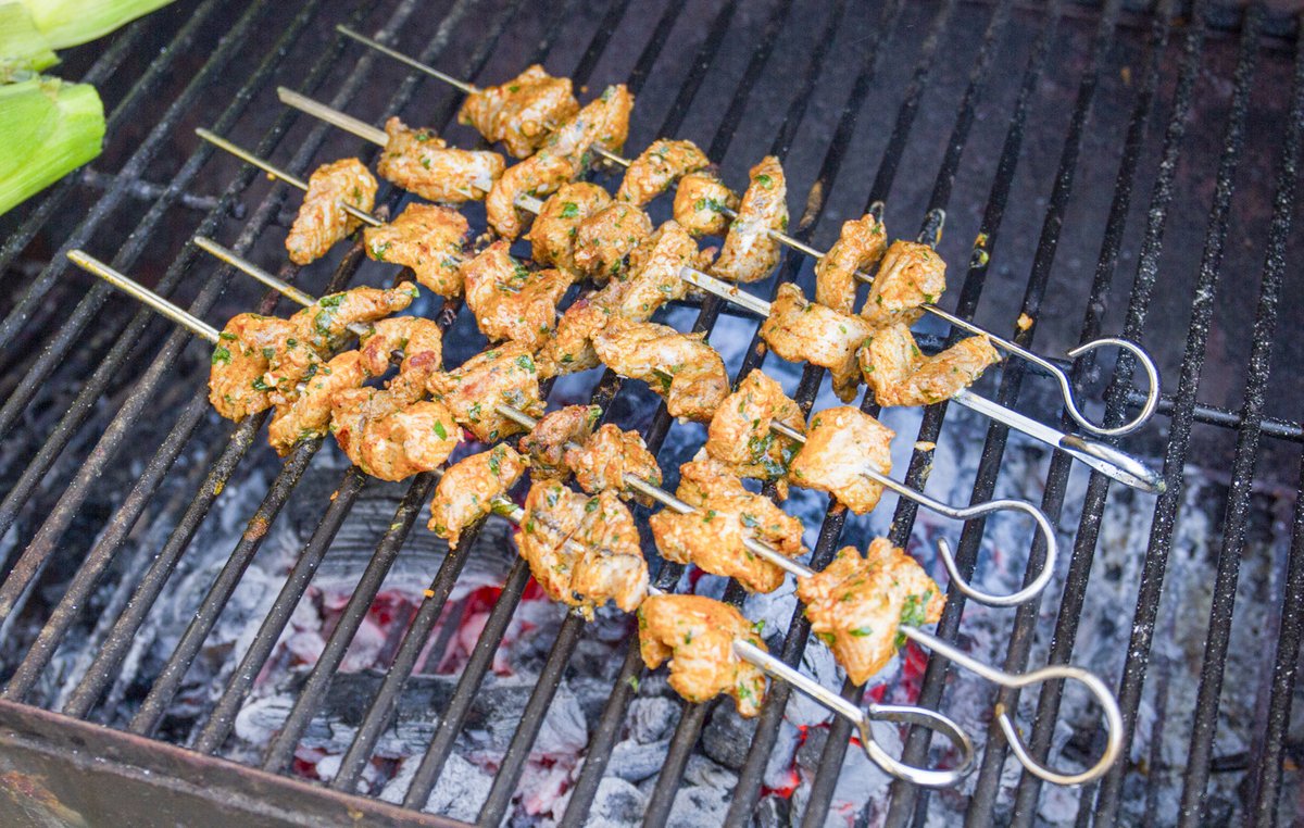 Alligator skewers on a grill.