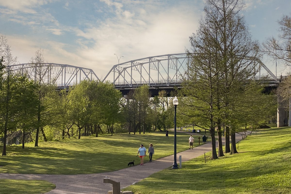 A view Old Iron Bridge on the Colorado River seen from the June Hill Pape Riverwalk trail in Bastrop