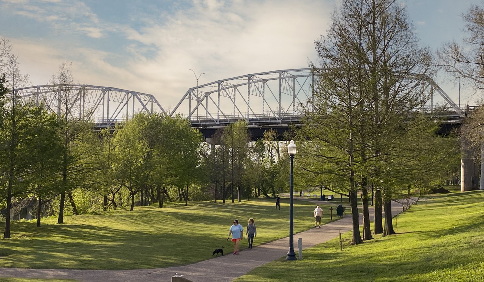 A view Old Iron Bridge on the Colorado River seen from the June Hill Pape Riverwalk trail in Bastrop