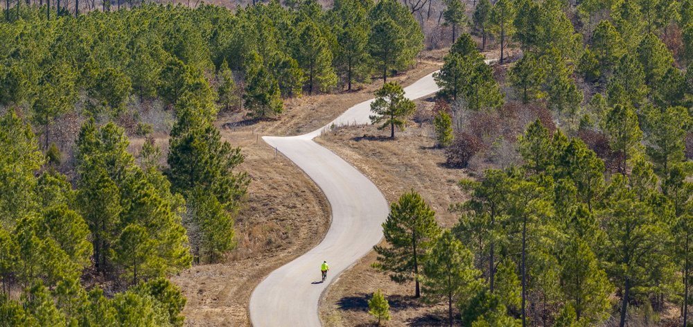 A person biking on a road.