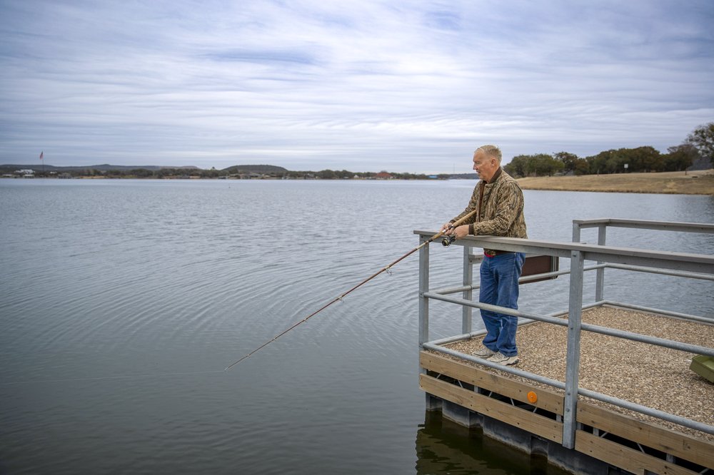 A man fishing on the floating fishing pier