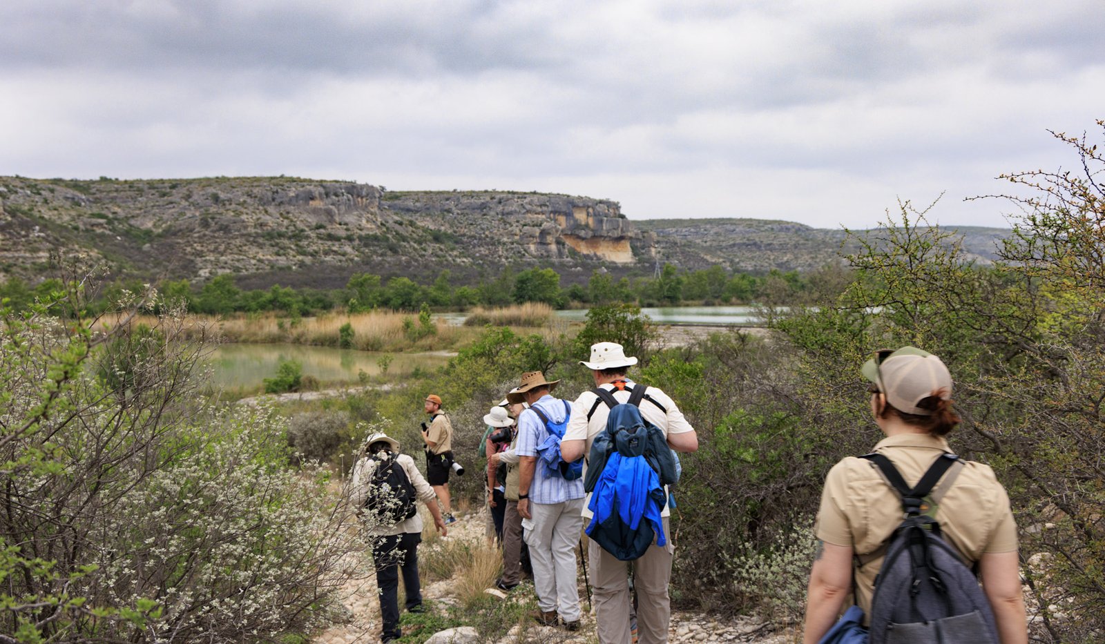 A group of people are hiking on a trail