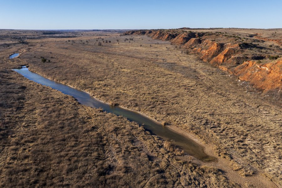 Matador Wildlife Management Area with a view of Pease River and a rocky ridge.