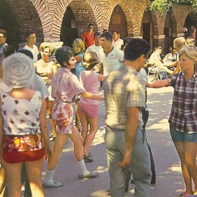 People dancing at a pavillion.