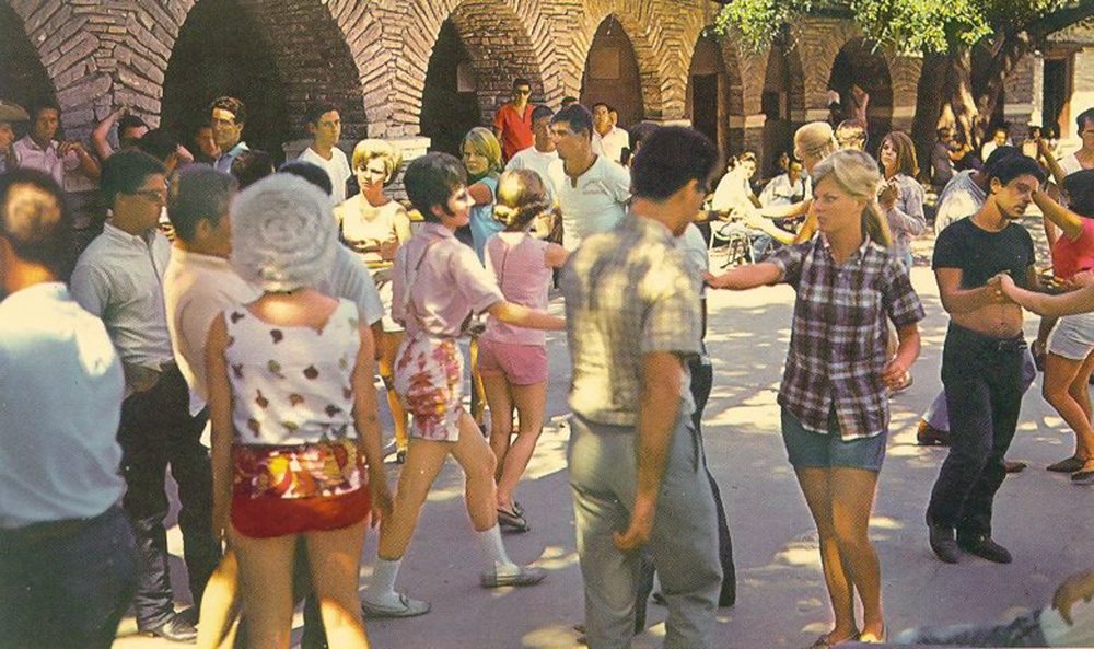 People dancing at a pavillion.