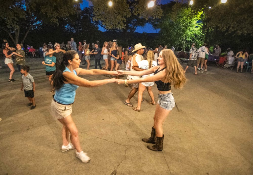 Two people dancing in the foreground