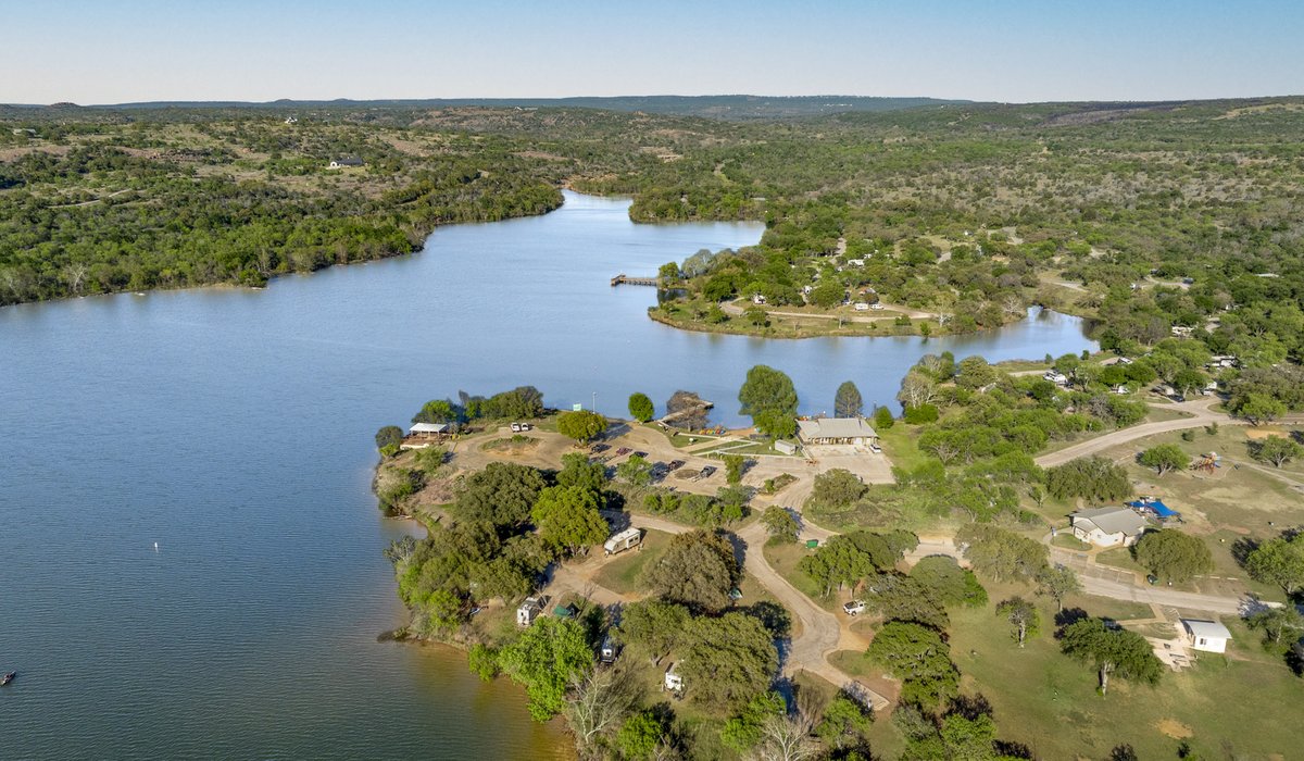 Inks lake surrounded by trees.