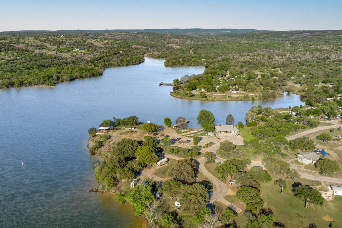Inks lake surrounded by trees.