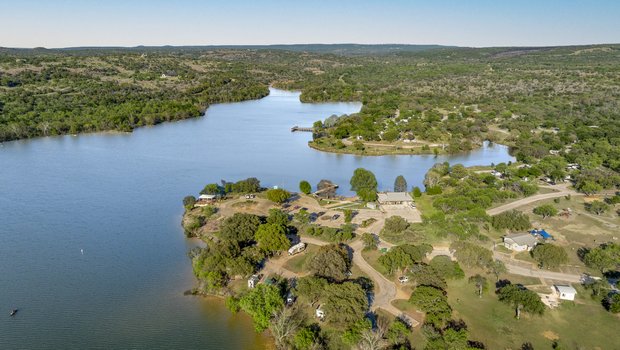 Inks lake surrounded by trees.