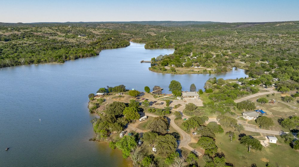 Inks lake surrounded by trees.
