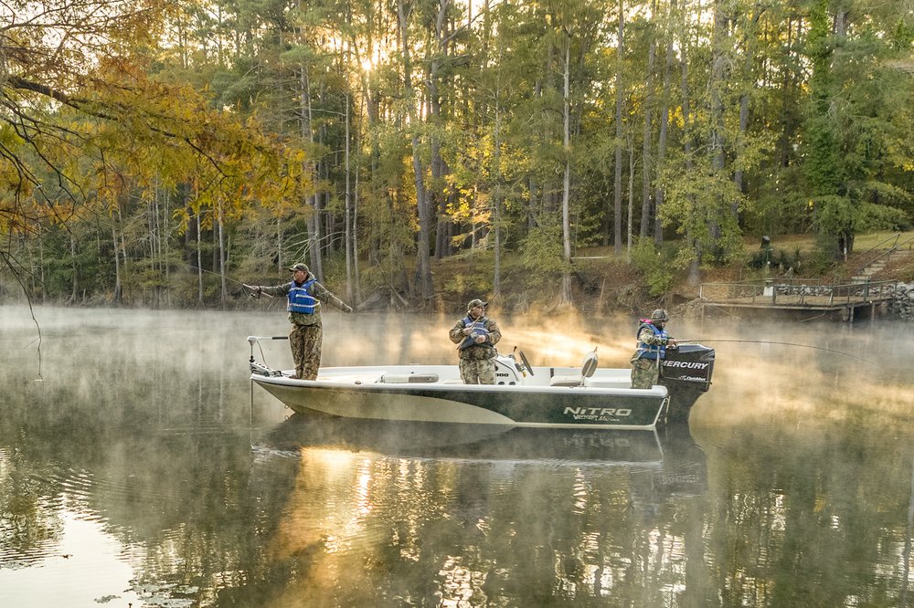 People on a boat in a lake.