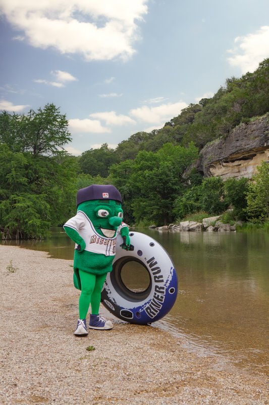 The San Antonio Missions mascot Ballapeno with a tube at Guadalupe River.