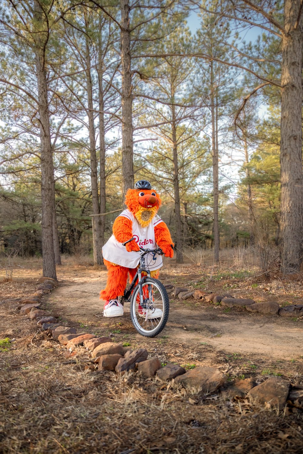 Frisco RoughRiders mascot Deuce biking at Ray Roberts.