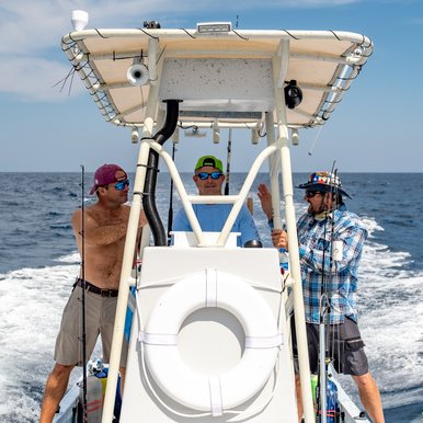 Fishermen heading out on a boat.