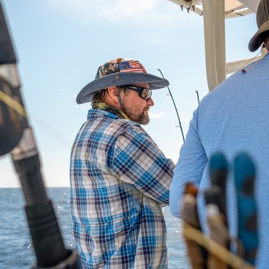 Fisherman on a boat at sea.