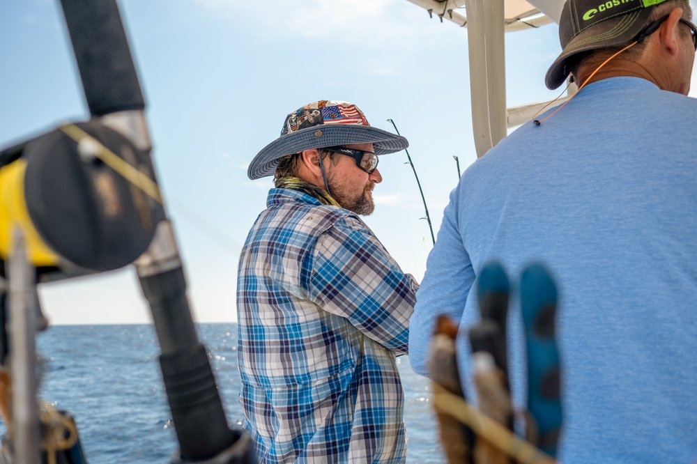 Fisherman on a boat at sea.
