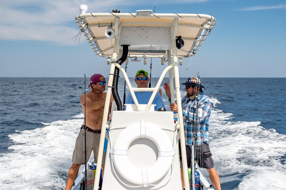 Fishermen heading out on a boat.