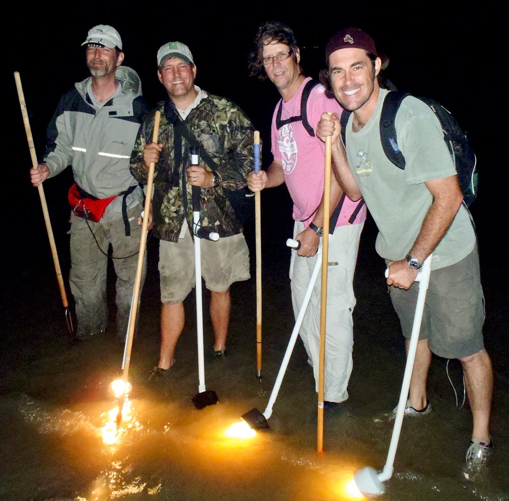Gigging for flounder at night.